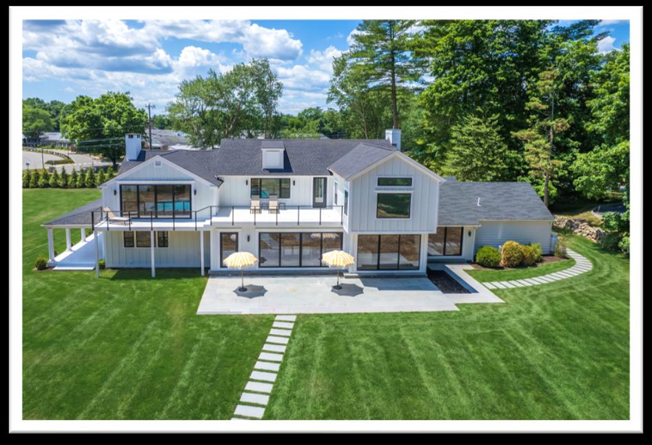 Modern white house with backyard patio